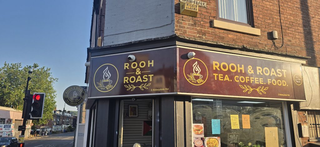 Front Image of Rooh & Roast Cafe in Sheffield. It shows the front sigange in day light. The cafe is located in Sheffield, just near the end of London Road